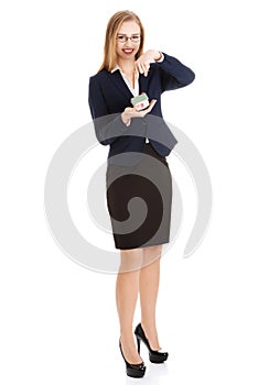 Businesswoman holding a model of house