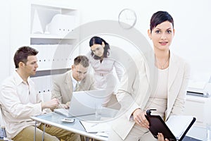 Businesswoman holding organizer photo