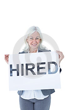 Businesswoman holding sign in front of her