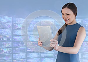 Businesswoman holding tablet with colourful blue screen visuals