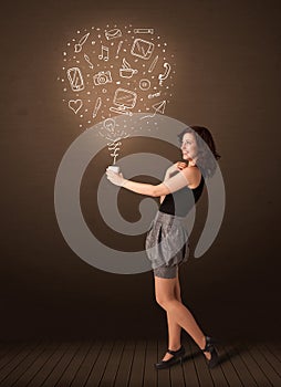 Businesswoman holding a white cup with social media icons