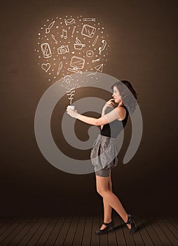 Businesswoman holding a white cup with social media icons