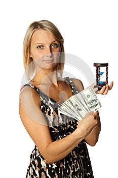 Businesswoman with hourglass and money