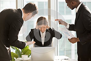 Businesswoman ignoring colleagues critical remarks