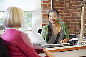 Businesswoman Interviewing Female Job Applicant In Office