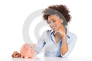 Businesswoman Looking At Piggybank photo