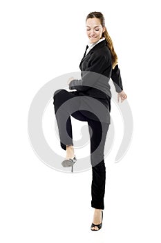 Businesswoman kicking
