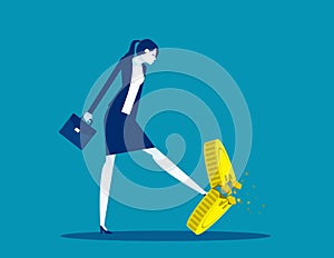 A businesswoman kicking a coin. Worthless coins