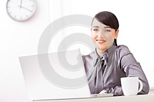 Businesswoman with laptop photo