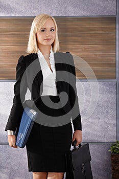 Businesswoman with laptop and briefcase