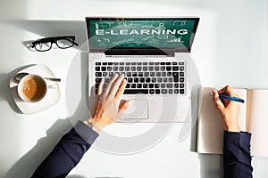 Businesswoman With Laptop Showing E-learning Concept On Screen