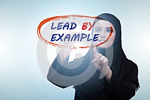 Businesswoman in lead by example concept