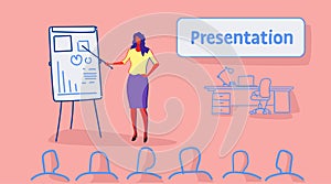 Businesswoman leader pointing financial graph on flip chart conference meeting presentation concept business woman team