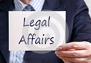 Businesswoman with Legal Affairs Sign