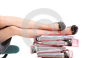 Businesswoman legs pile of binders reast break