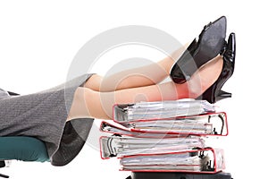Businesswoman legs pile of ring binders reast break