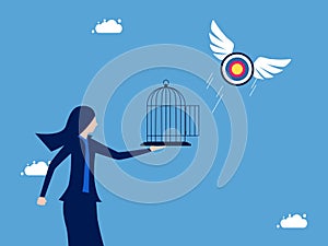 Businesswoman let the target fly out of the cage. liberation and freedom in goal