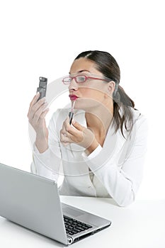 Businesswoman with lipstick and mobile phone