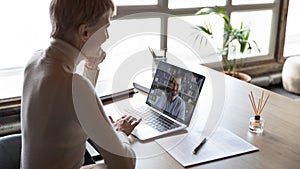 Businesswoman listening applicant during distant job interview by video call