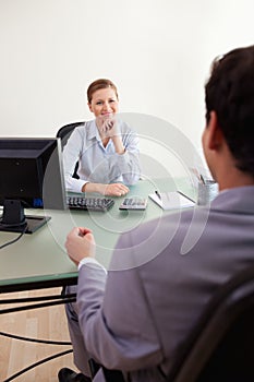 Businesswoman listening to client