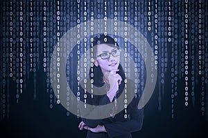 Businesswoman looking at binary code