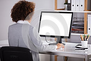 Businesswoman Looking At Blank Computer Screen