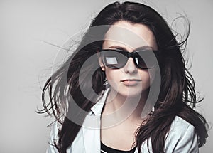 Businesswoman looking through glasses