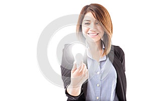 Businesswoman looking at an LED light bulb