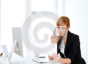 Businesswoman looking into papers