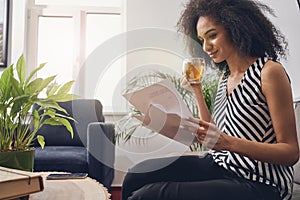 Businesswoman looking through the papers during the tea break