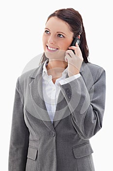 Businesswoman looking up while smiling on the phone