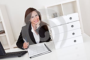 Businesswoman With Lots of Paperwork