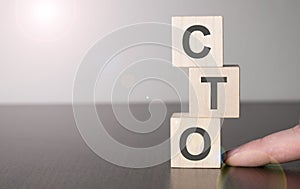 Businesswoman made word cto with wood building blocks