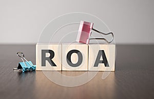 Businesswoman made word roa with wood building blocks