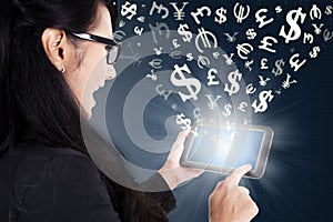 Businesswoman making money online with tablet