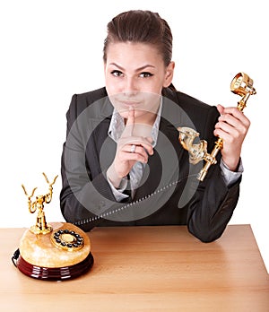 Businesswoman making silence gesture.