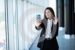 Businesswoman making video call to business partner using laptop, looking at screen with virtual web chat, contacting client by