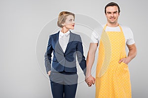 businesswoman and male householder holding hands feminism concept