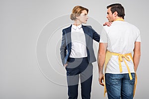 businesswoman and male householder standing together feminism concept