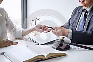 Businesswoman and Male lawyer or judge consult and conference having team meeting with client at law firm in office, Law and Legal