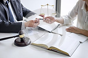 Businesswoman and Male lawyer or judge consult and conference having team meeting with client at law firm in office, Law and Legal