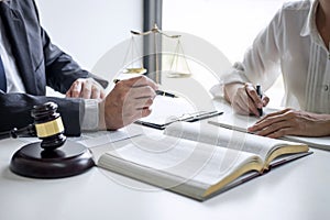 Businesswoman and Male lawyer or judge consult and conference having team meeting with client at law firm in office, Law and Legal