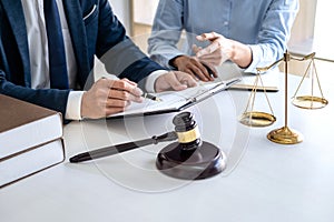 Businesswoman and Male lawyer or judge consult and conference having team meeting with client at law firm in office, Law and Legal