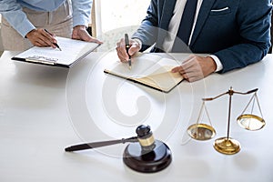 Businesswoman and Male lawyer or judge consult and conference having team meeting with client at law firm in office, Law and Legal