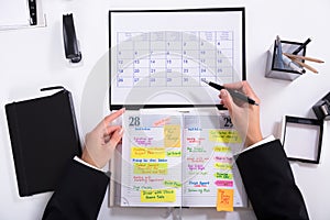 Businesswoman Marking Schedule