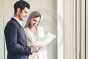 Businesswoman meeting with businessman in office.