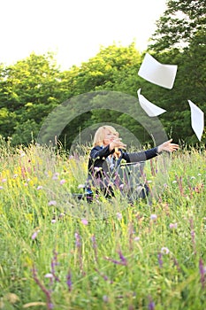 Businesswoman on nature catch document