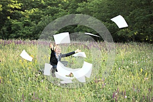 Businesswoman on nature catch documents