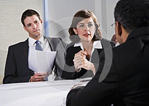 Businesswoman negotiating with men