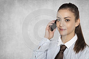 Businesswoman is negotiating on a mobile phone